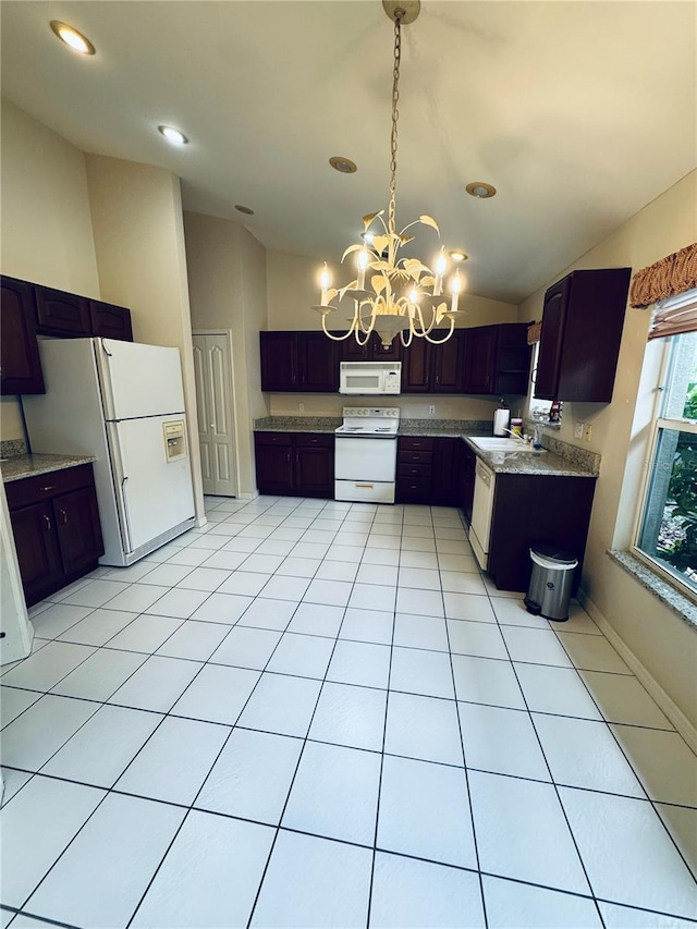 kitchen with lofted ceiling, sink, a chandelier, and white appliances