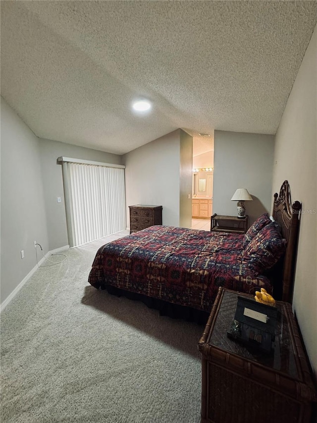 carpeted bedroom featuring a textured ceiling