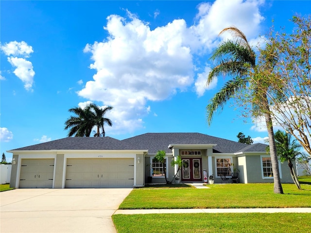 view of front facade with a front lawn and a garage