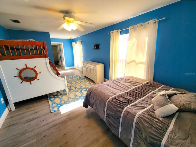 bedroom featuring ceiling fan and wood-type flooring