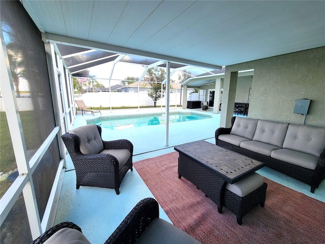 view of swimming pool featuring glass enclosure, an outdoor living space, and a patio