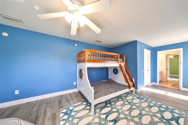 bedroom featuring ceiling fan and wood-type flooring