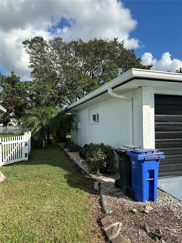 view of home's exterior with a lawn