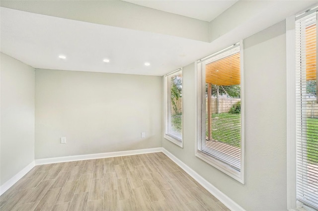 empty room with light hardwood / wood-style floors