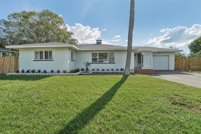 single story home with a front lawn and a garage