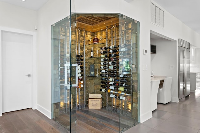 wine area featuring dark wood-type flooring