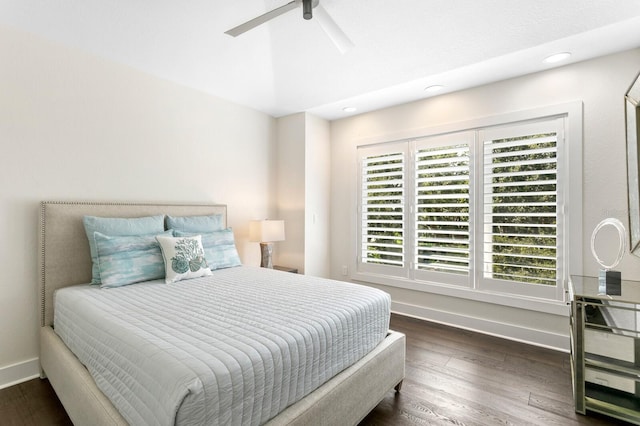 bedroom with ceiling fan and dark hardwood / wood-style flooring