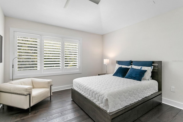 bedroom with ceiling fan and dark wood-type flooring