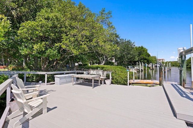 deck featuring a boat dock and a water view