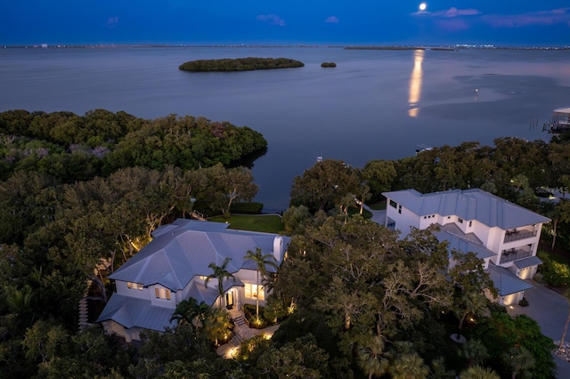 aerial view at dusk with a water view