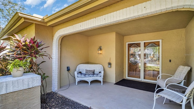 doorway to property featuring a patio area