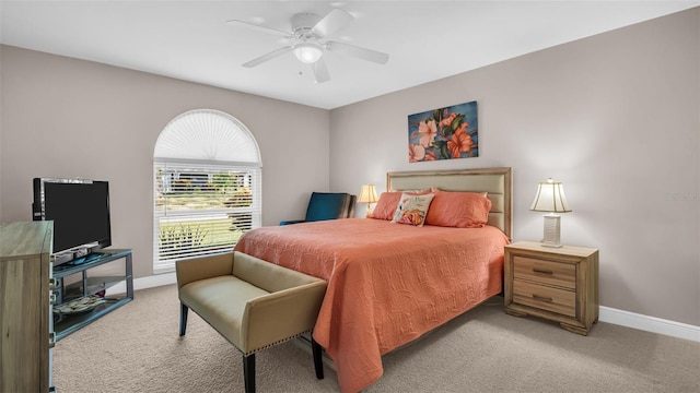 bedroom featuring light colored carpet and ceiling fan