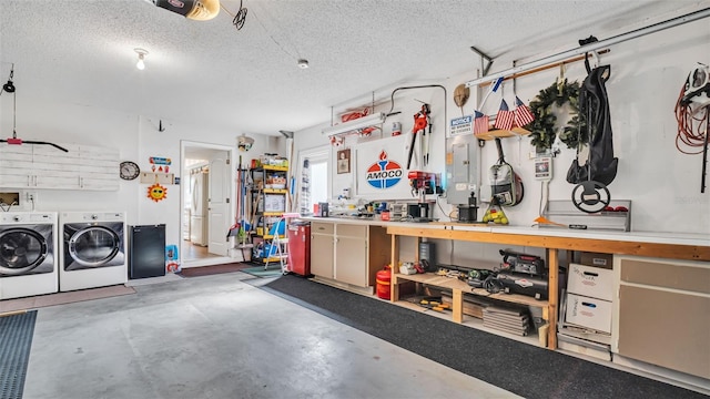 garage featuring a garage door opener, fridge, independent washer and dryer, and a workshop area