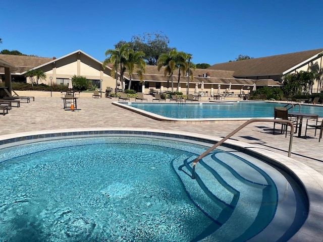 view of swimming pool featuring a patio