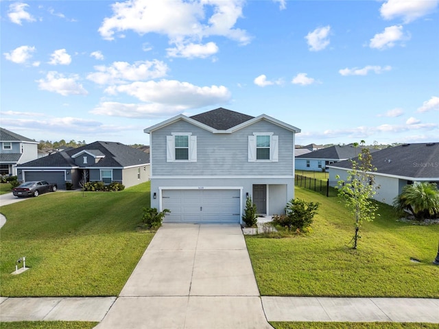 view of front of home with a garage and a front lawn