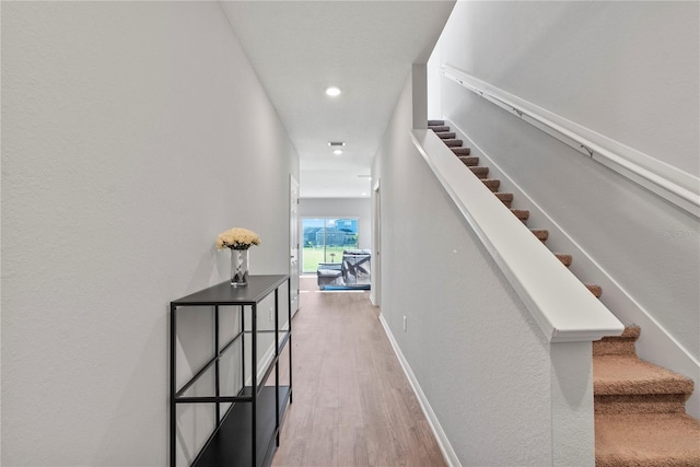 hallway featuring hardwood / wood-style flooring