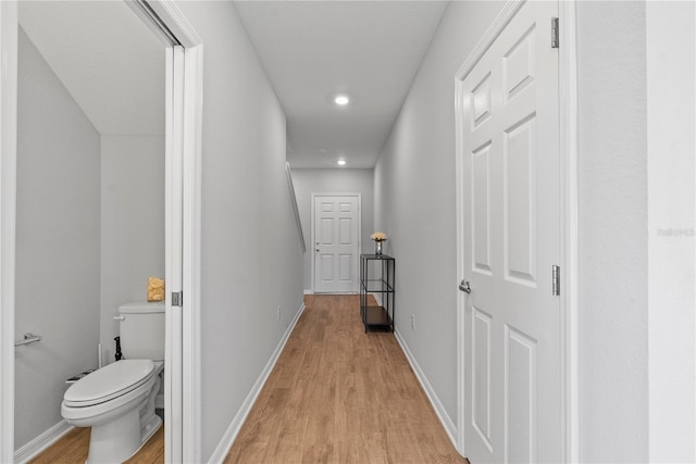 hallway with light wood-type flooring