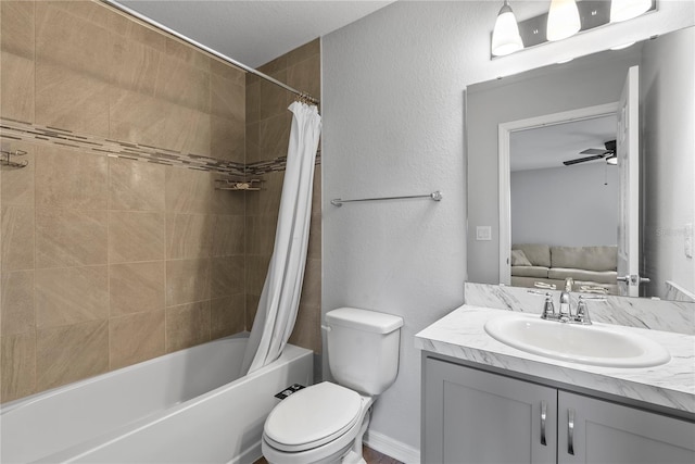 full bathroom featuring ceiling fan, vanity, toilet, and shower / tub combo