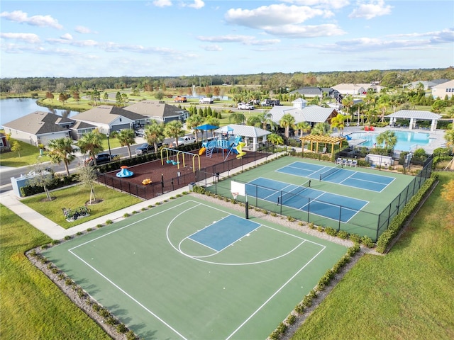 birds eye view of property with a water view