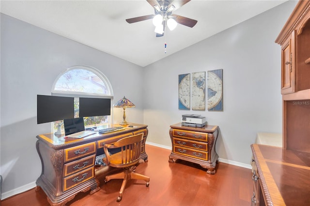 office featuring dark wood-type flooring, lofted ceiling, and ceiling fan