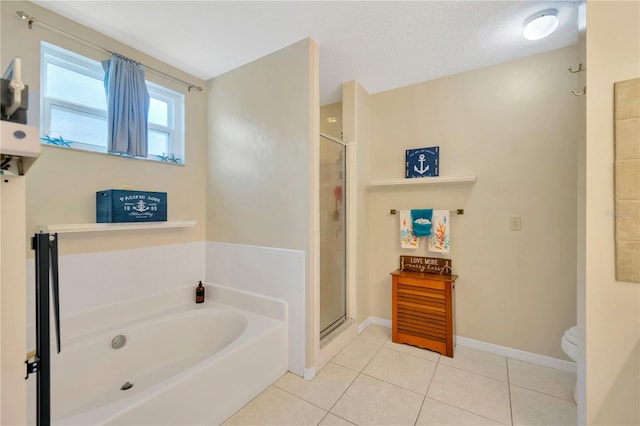 bathroom with independent shower and bath, tile patterned floors, toilet, and a textured ceiling