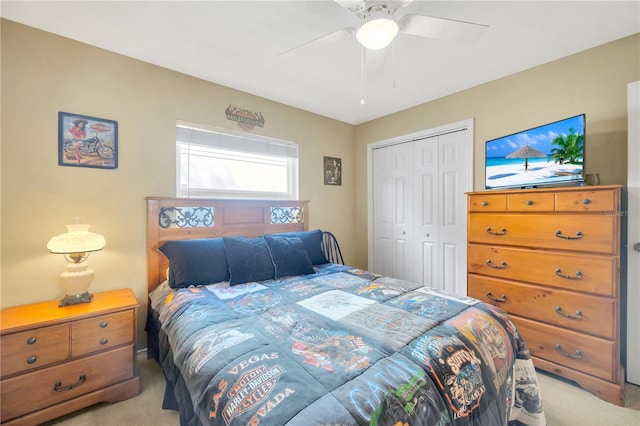 bedroom with a closet, light carpet, and ceiling fan