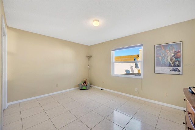 unfurnished room with light tile patterned floors