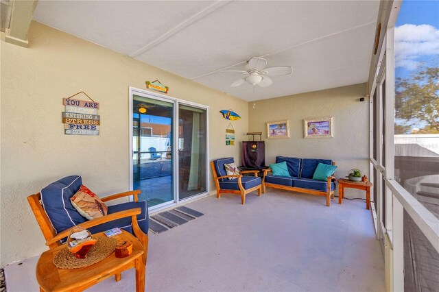 sunroom with a wealth of natural light and ceiling fan