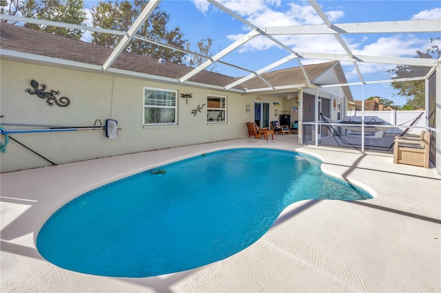 view of pool featuring a lanai and a patio area