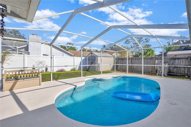 view of pool featuring a lanai, a storage shed, and a patio area