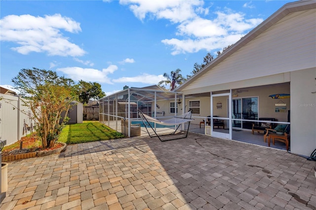 view of patio / terrace with a lanai and a pool