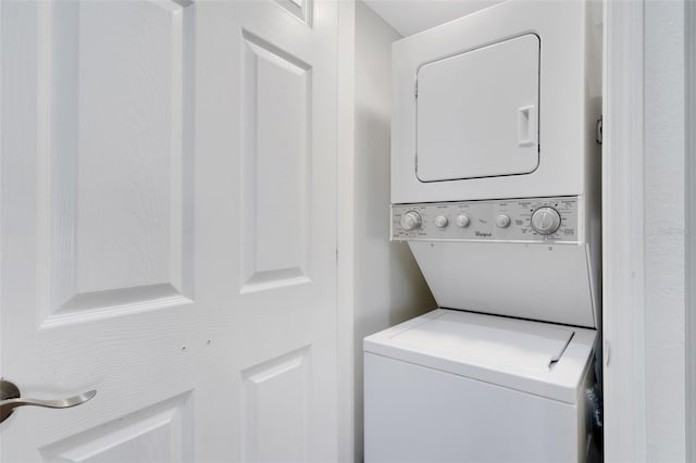 laundry area featuring stacked washer and dryer