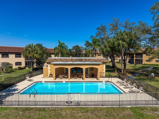 view of swimming pool with a patio