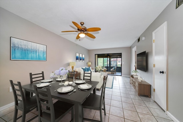 tiled dining area featuring ceiling fan