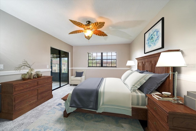 bedroom featuring access to exterior, ceiling fan, and light carpet