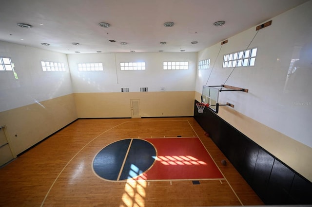 view of basketball court featuring plenty of natural light