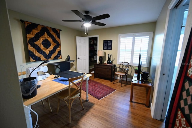 office space featuring hardwood / wood-style flooring and ceiling fan