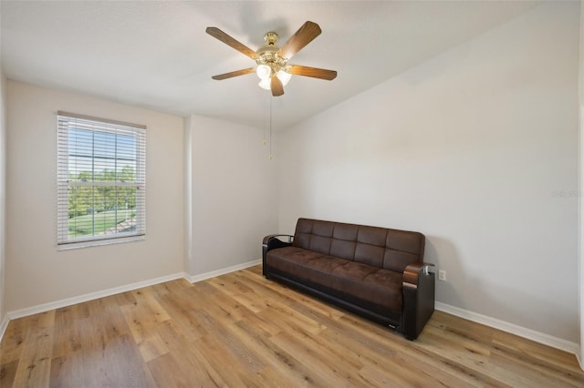 sitting room featuring light hardwood / wood-style floors and ceiling fan