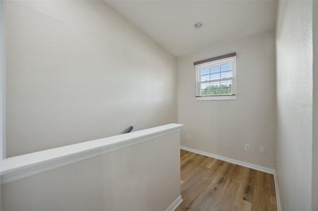 interior space with vaulted ceiling and light hardwood / wood-style floors