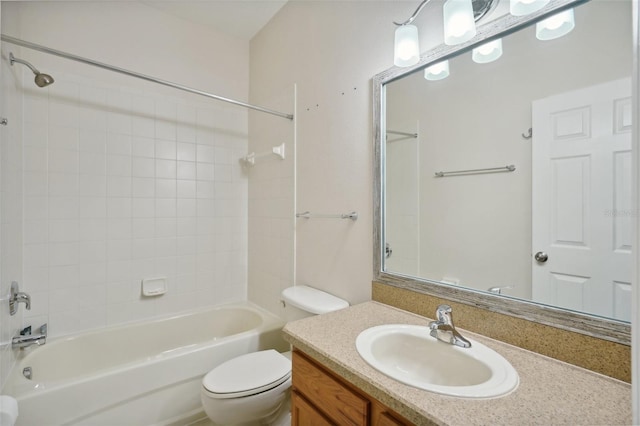 full bathroom featuring vanity, toilet, and tiled shower / bath