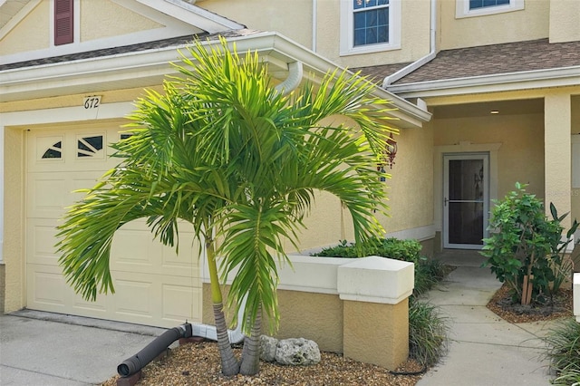 view of exterior entry with a garage