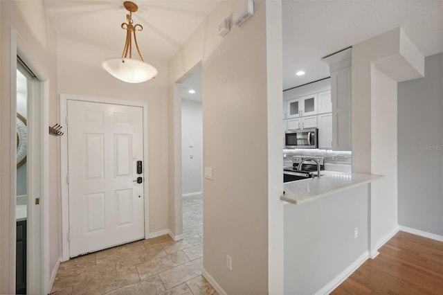 foyer entrance featuring light wood-type flooring