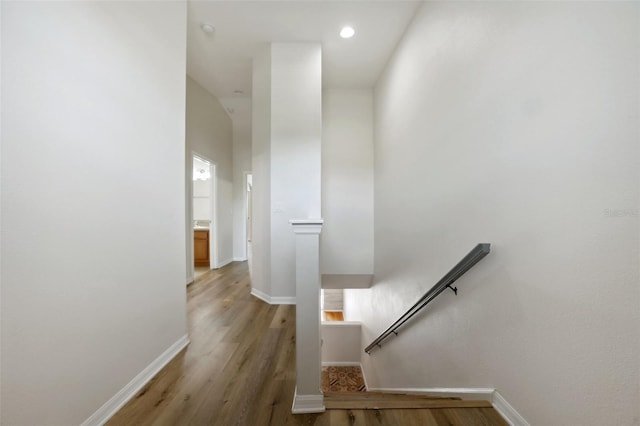 stairway featuring hardwood / wood-style floors