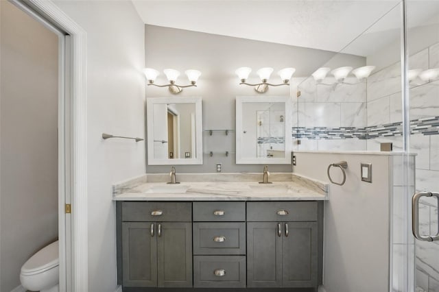 bathroom featuring vanity, toilet, walk in shower, and lofted ceiling