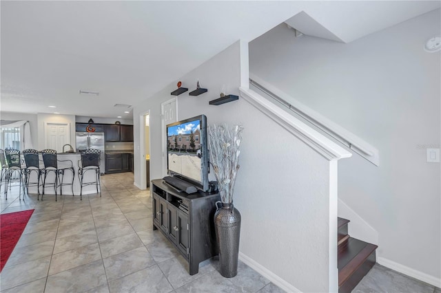 stairs with tile patterned flooring