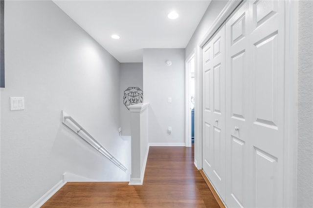 hallway with dark hardwood / wood-style floors