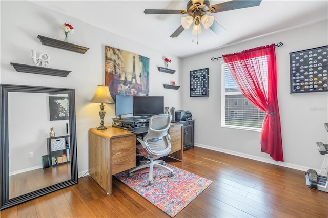 office space featuring ceiling fan and dark wood-type flooring