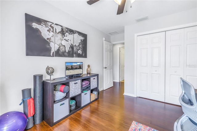 playroom featuring dark hardwood / wood-style floors and ceiling fan