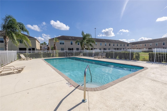 view of swimming pool with a patio area