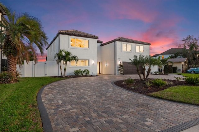 mediterranean / spanish-style house featuring a garage